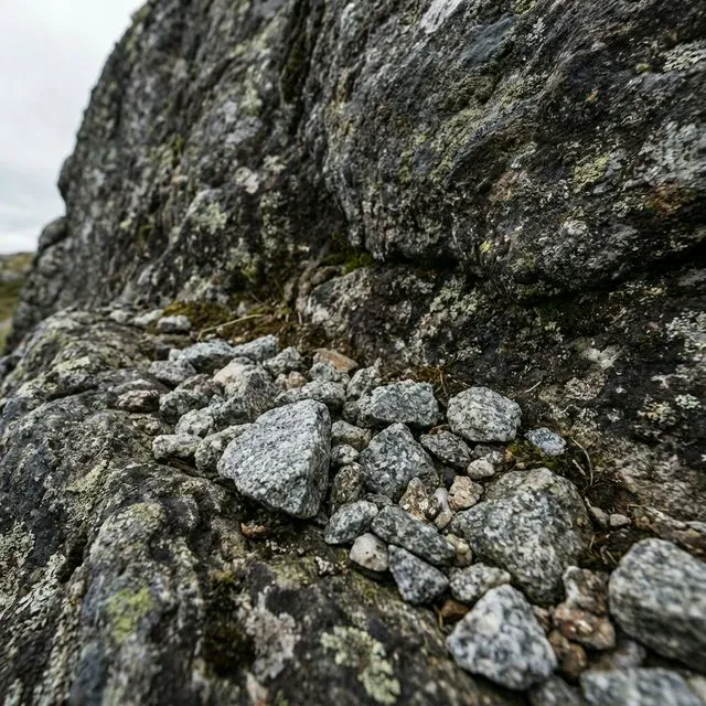 Close-up of highly textured, unpolished gray granite gravel